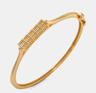 Minimal twisted rope gold bangle with a refined finish.