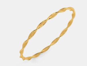 Traditional temple-inspired gold kada with fine detailing.