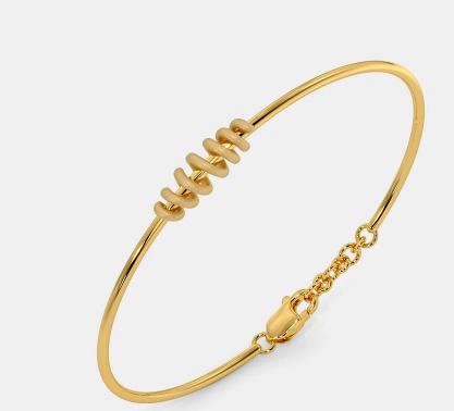 Antique-style gold bangle with embossed leaf designs.